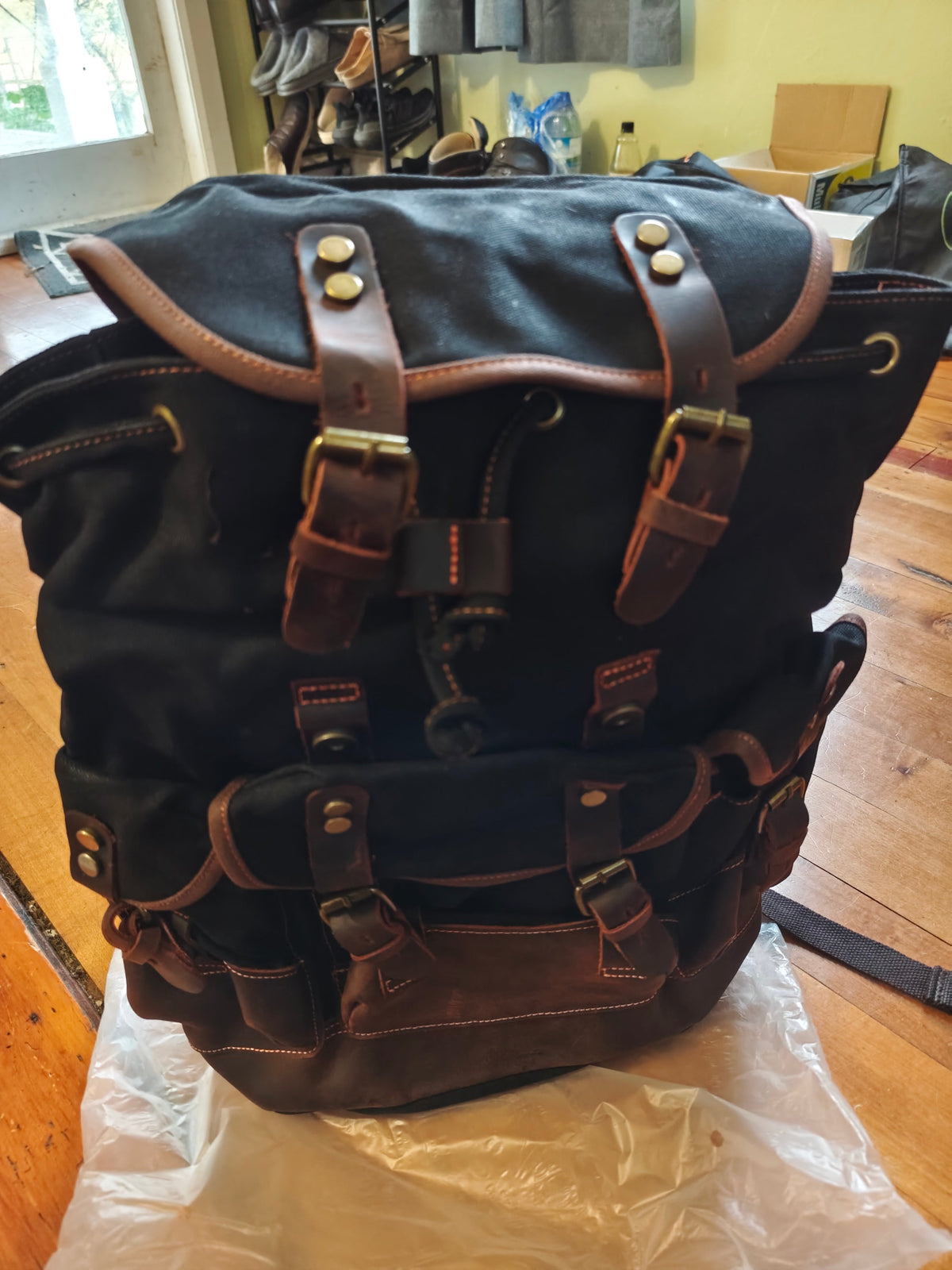 Waxed canvas and leather backpack by Mead's Supply & Equipment Outfitters, featuring a retro heritage design perfect for travel and adventure.