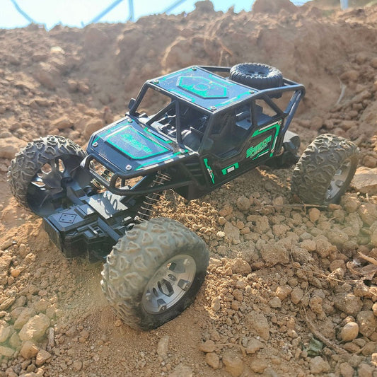 Green rechargeable off-road climbing RC car from dealonline.co.nz, shown on rugged terrain ready for outdoor adventures.