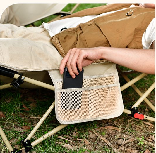 Black ECOTREK portable folding beach chair with enhanced size and comfort, featuring cushioned seat and sturdy frame for outdoor relaxation.