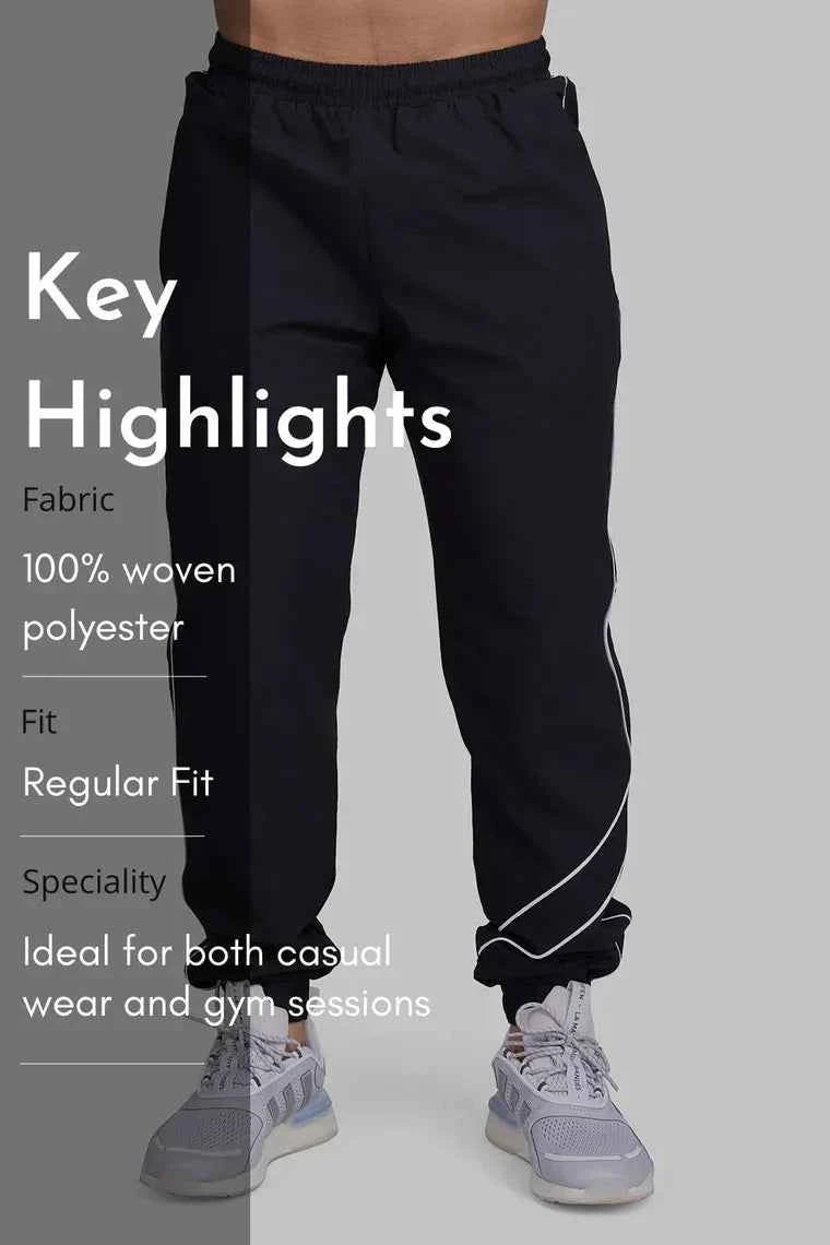 Fuaark Nz Army Sprint Joggers, black track pants with elastic waistband and tapered design, suitable for athletic and casual wear.