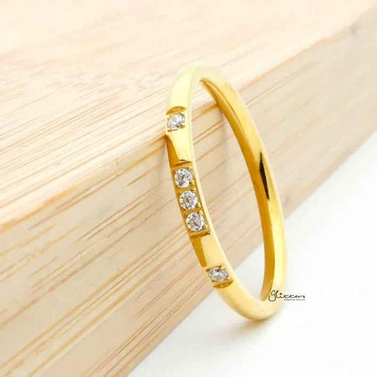 Gold stainless steel ring with five CZ inlays, featuring a band design from Glitters.