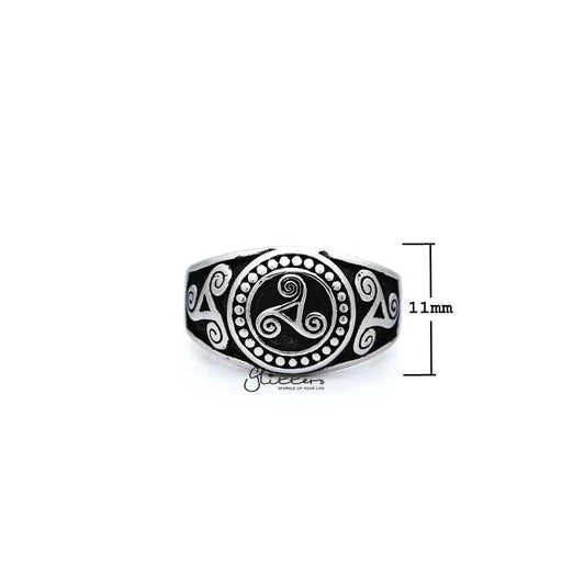Stainless steel men's ring with antiqued triskele and triple spiral design, cast by Glitters, showcasing intricate metalwork and craftsmanship.