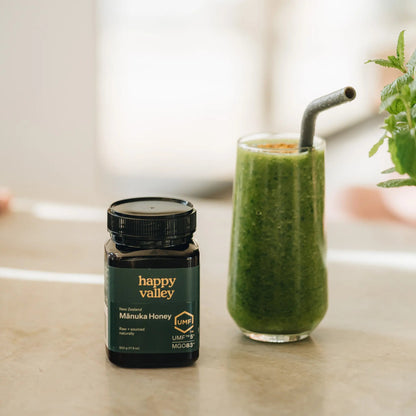Jar of Happy Valley Honey UMF 5+ Manuka Honey with golden color and label, highlighting natural health benefits.