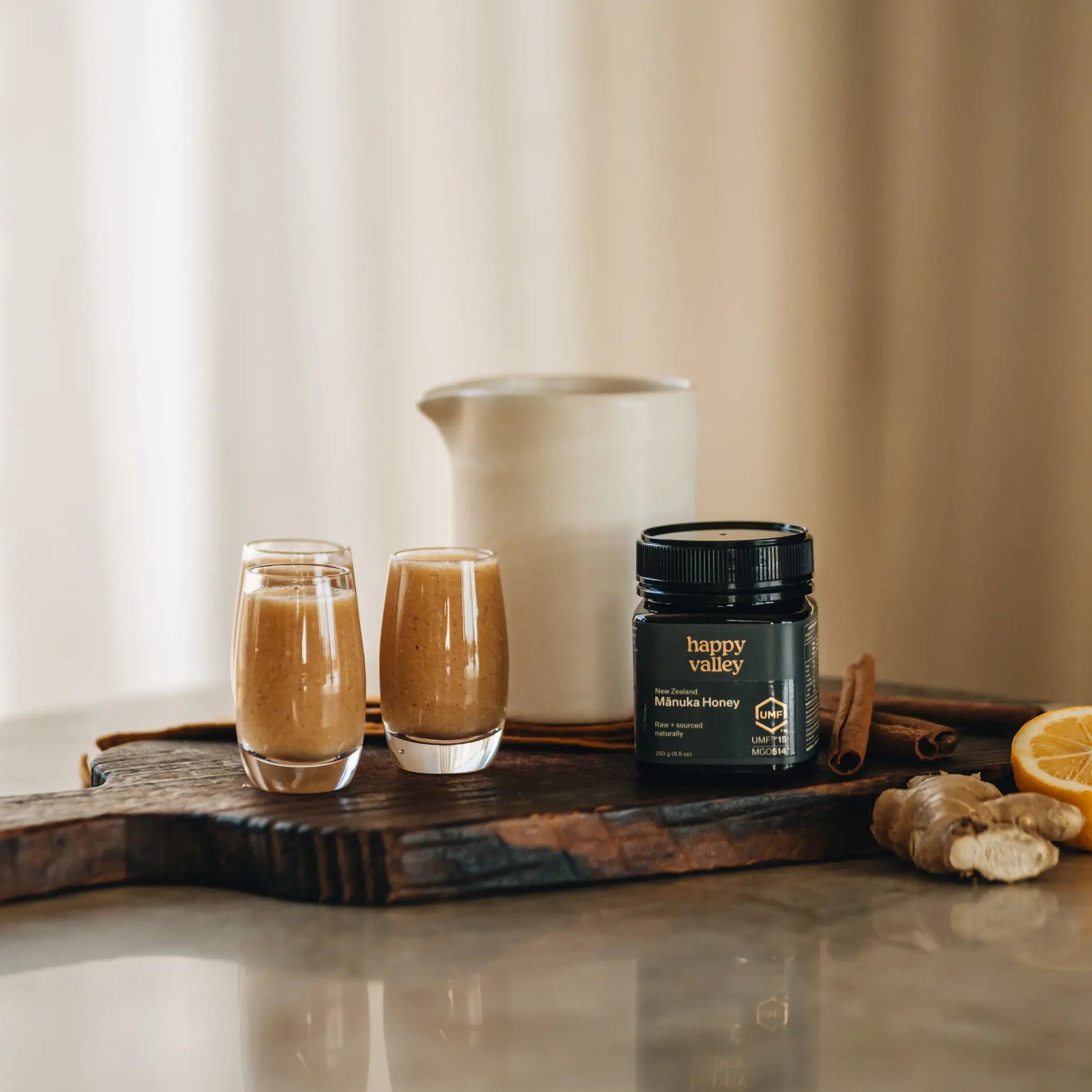 Jar of Happy Valley Honey Manuka Honey UMF® 15+ with golden honey visible in a clear glass jar.