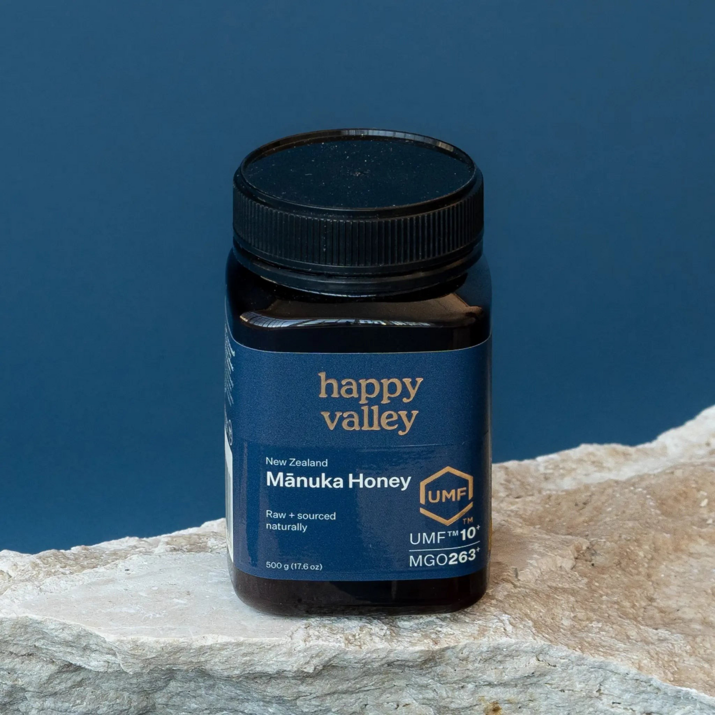 Jar of UMF® 10+ Manuka Honey by Happy Valley Honey, showcasing the honey's rich, golden appearance in a clear glass jar.