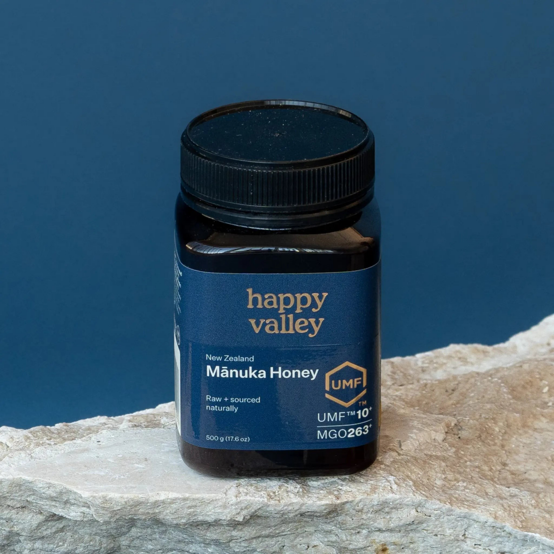 Jar of UMF® 10+ Manuka Honey by Happy Valley Honey, showcasing the honey's rich, golden appearance in a clear glass jar.
