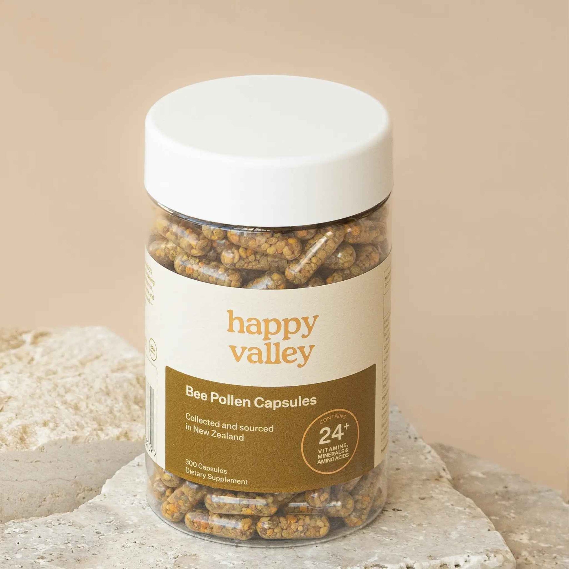 Two bottles of Happy Valley Honey Bee Pollen Capsules 300 with white labels and yellow caps, displayed on a white background.