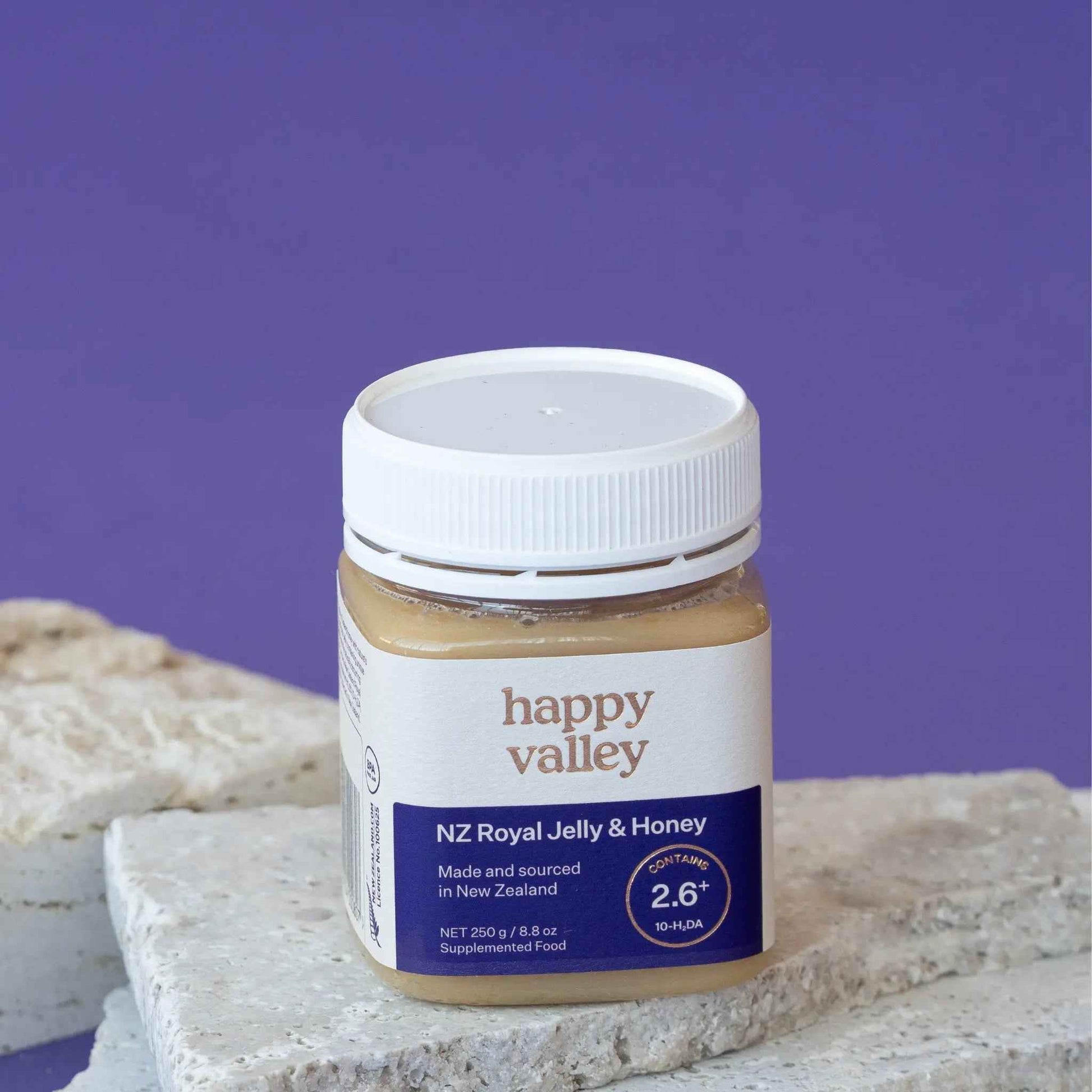 Jar of Happy Valley Honey Royal Jelly with honeycomb, showcasing fresh royal jelly and golden honey texture.