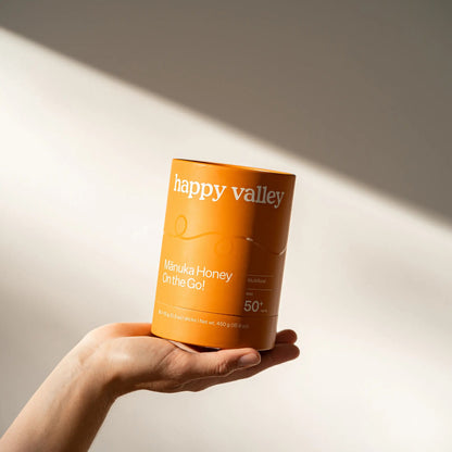 Five on-the-go multifloral Manuka honey packets with MGO 50+ from Happy Valley Honey, featuring honey sticks for convenient use.