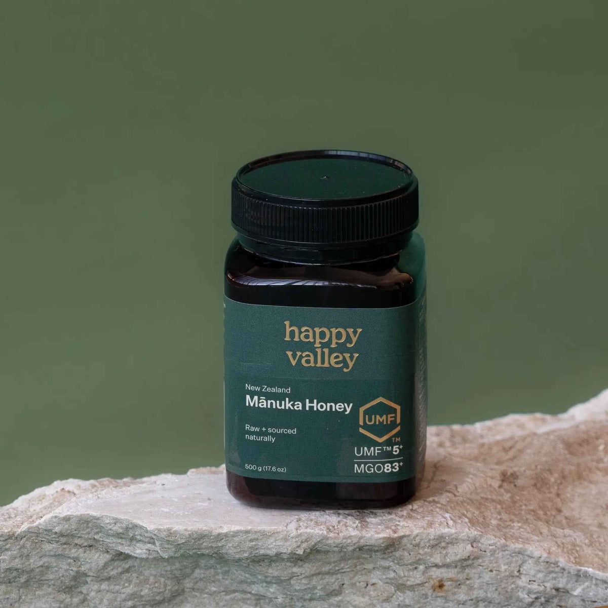 Jar of Happy Valley Honey UMF 5+ Manuka Honey with golden color and label showing UMF 5+ on a white background