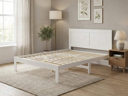 Solid pine double bed frame from Sue-E Furniture, showcasing a sturdy, minimalist design with a headboard and clean lines.