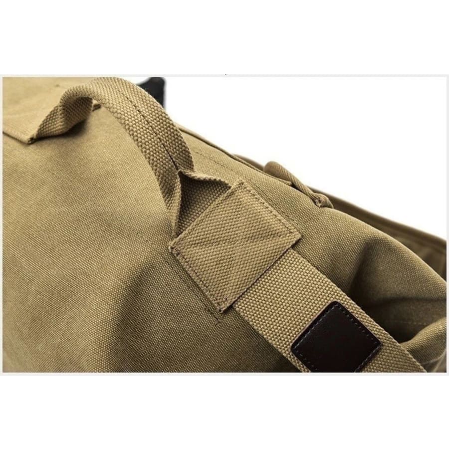 Khaki 9eight5 backpack duffel bag with military style, 55cm x 30cm x 20cm, featuring sturdy straps and multiple compartments.
