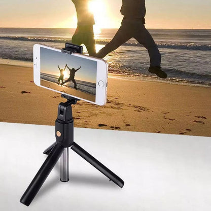 9eight5 selfie stick with remote and stand for phone and tablet, showing adjustable grip and remote control in use