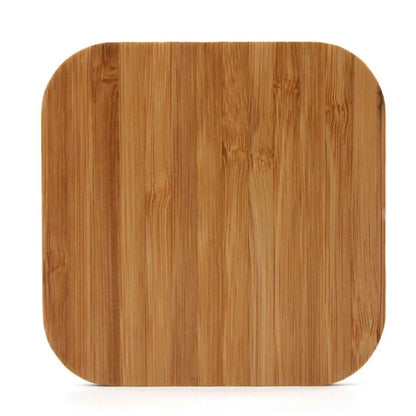 Wireless charger by 9eight5 for phones and tablets, shown on a flat surface with a device charging wirelessly.