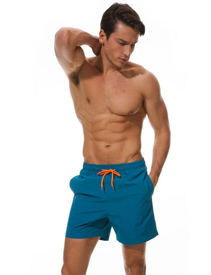 Men's beach boardshorts by ShopHub NZ featuring a sporty surf design, quick-dry fabric, and comfortable fit for swimming and beach activities.