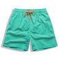 Men's beach boardshorts by ShopHub NZ featuring surf-style design, quick-dry fabric, and vibrant colors for swimming and beach sports.