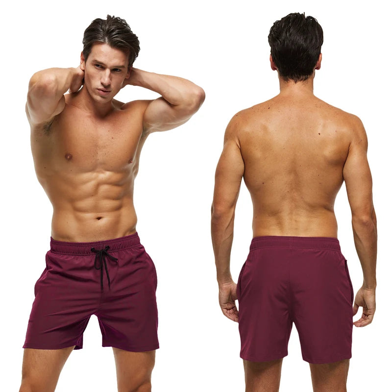 Men's summer swimming shorts by ShopHub NZ, quick-dry polyester with breathable mesh lining and a pocket for active water sports.