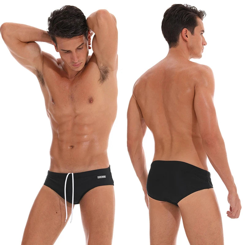 Men's low waist swim briefs with bold print design from DATIFER, featuring a snug fit and vibrant pattern.
