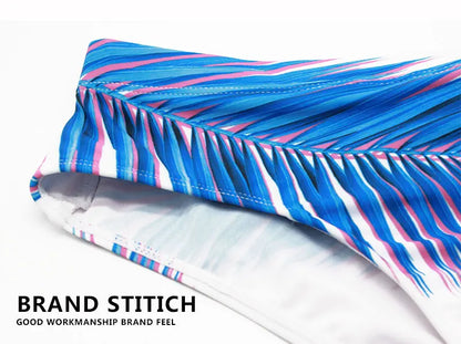 Men's low waist swim briefs with vibrant print design, stylish men's swimwear from ShopHub NZ.
