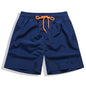 Men's beach boardshorts by ShopHub NZ featuring sporty surfing style, lightweight fabric, and vibrant color for ocean swimming and beach activities.