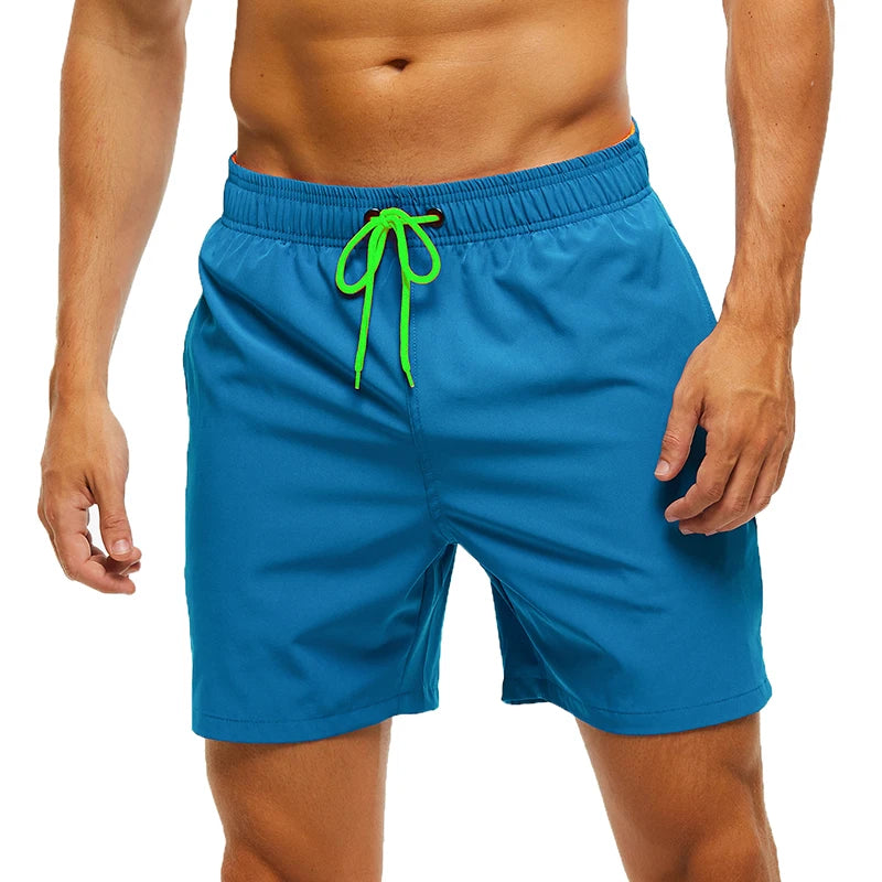 Men's classic polyester board shorts in navy with white stripe detail, designed for comfort and style during beach or pool days.