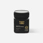 Jar of Happy Valley Honey Mānuka Honey UMF® 20+ with golden honey visible in a clear glass jar.
