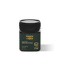 Jar of Happy Valley Honey UMF 5+ Mānuka Honey with golden color and label showing UMF rating and natural honey texture.