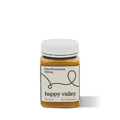 Jar of Rewarewa native honey from Happy Valley Honey, showcasing rich, golden raw honey with Rewarewa flower nectar.