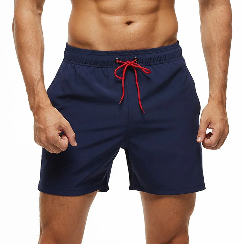 Men's polyester board shorts from DATIFER, featuring a classic design and vibrant print, ideal for beach or pool wear.