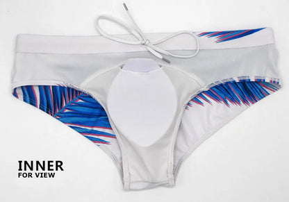Men's low waist swim briefs with bold print design, designed for comfort and style in vibrant swimwear by ShopHub NZ.
