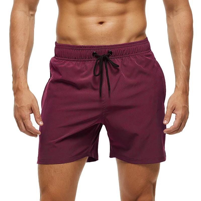 Men's summer swimming shorts by ShopHub NZ, quick-dry polyester with breathable mesh lining and side pocket.