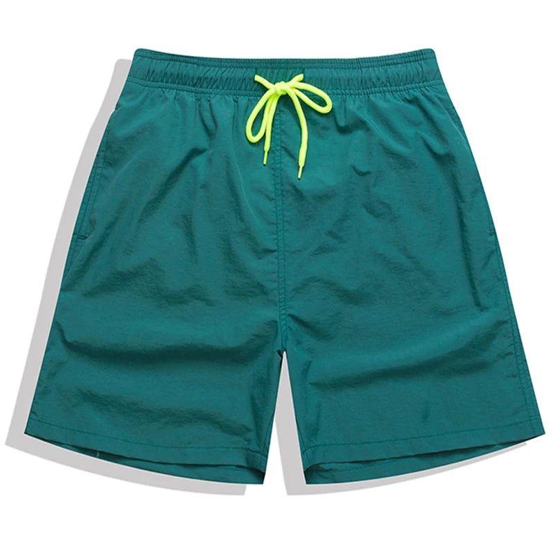 Men's beach boardshorts by ShopHub NZ featuring colorful surf-inspired patterns and a relaxed fit for swimming and beach activities.