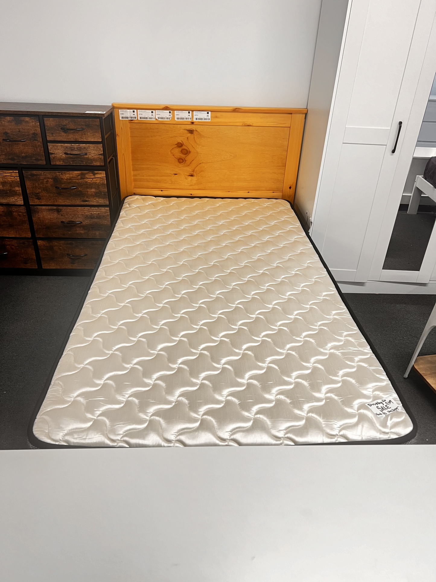Solid honey pine single bed frame from Sue-E Furniture with a sturdy design and simple headboard, ideal for a modern bedroom.
