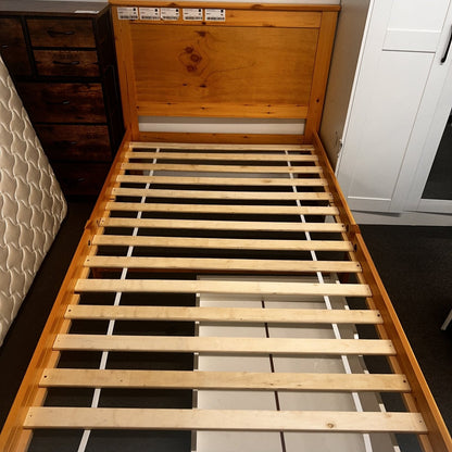 Solid pine 'Metro' single bed frame by sue-e furniture with honey finish, showcasing a sturdy wooden bed base with clean design.