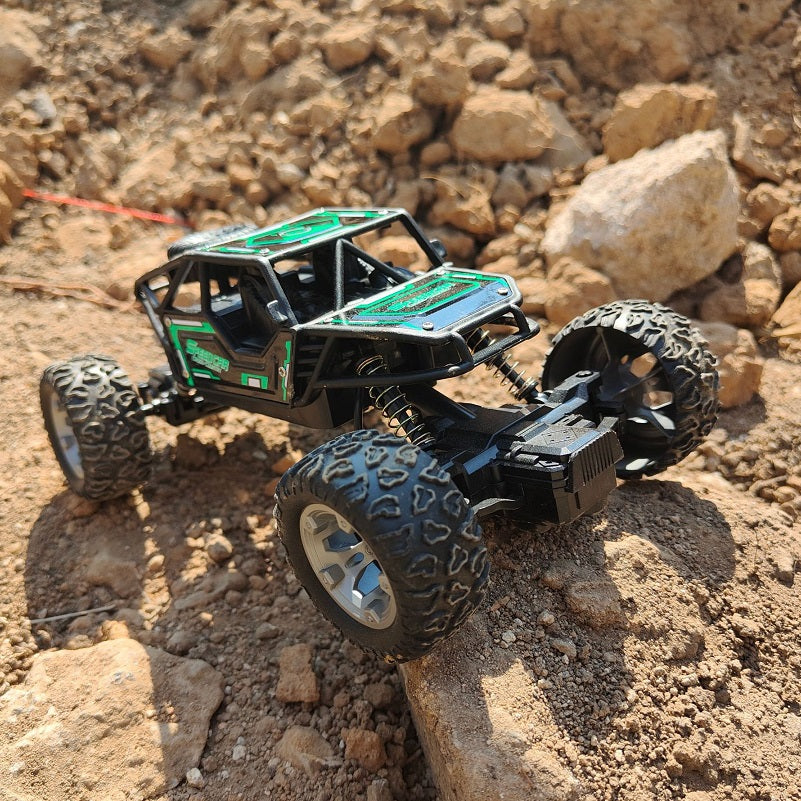Green rechargeable off-road climbing RC car by dealonline.co.nz, designed for outdoor terrain and off-road adventures.