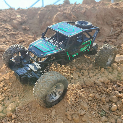 Green rechargeable off-road climbing RC car from dealonline.co.nz, shown on rugged terrain ready for outdoor adventures.