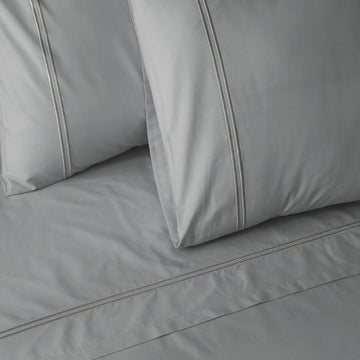 Organic cotton coloured sheet set in greystone with 250 thread count, featuring soft, smooth fabric from Whites of London NZ.