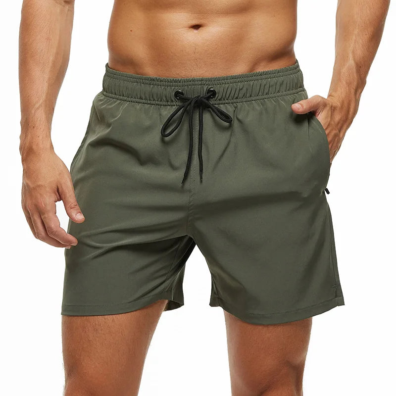 Men's summer swimming shorts by ShopHub NZ, quick-dry polyester with breathable mesh lining, solid design, and pocket for comfort.