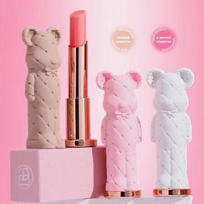 Pink lipstick with bear-shaped cases on a pink background