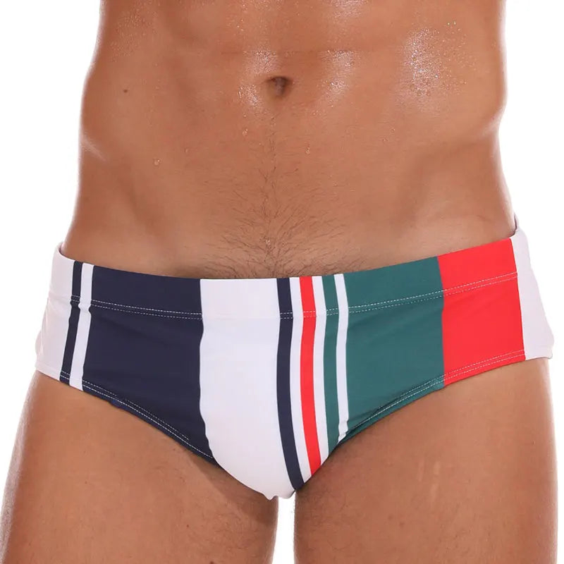 Men's low waist swim briefs with bold print from ShopHub NZ, featuring vibrant colors and a sleek, sexy fit.