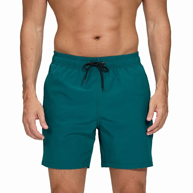Men's classic polyester board shorts in navy with a drawstring waist, designed for active beachwear and swimming.