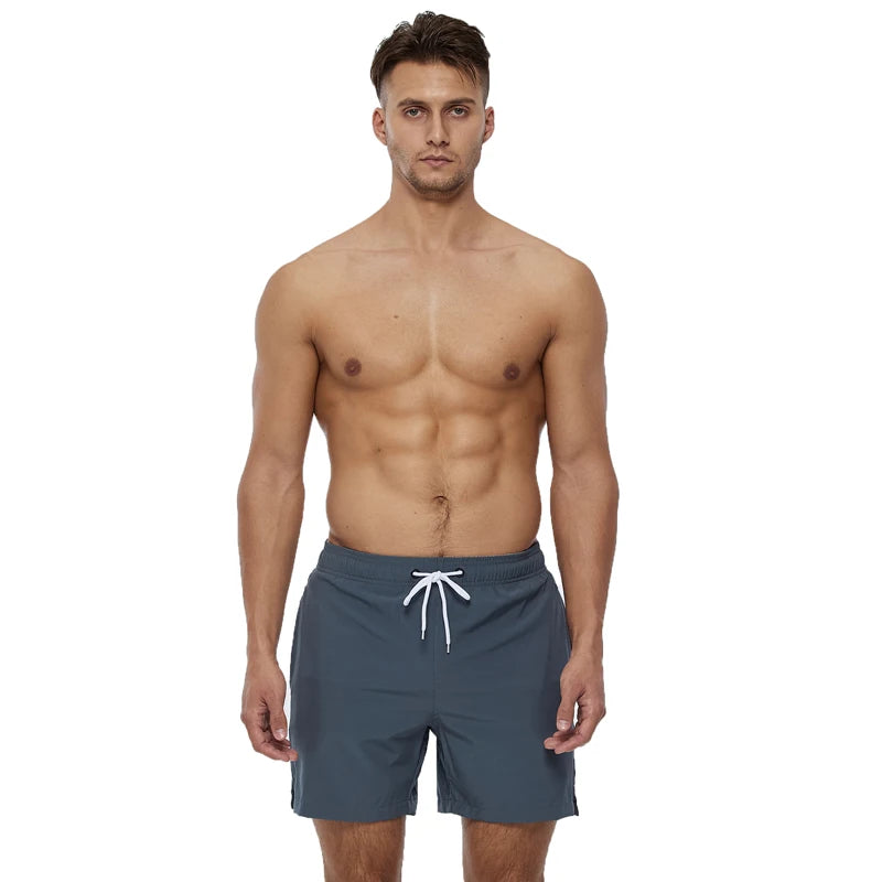 Men's polyester board shorts from DATIFER, featuring a classic design with a comfortable fit and stylish pattern.