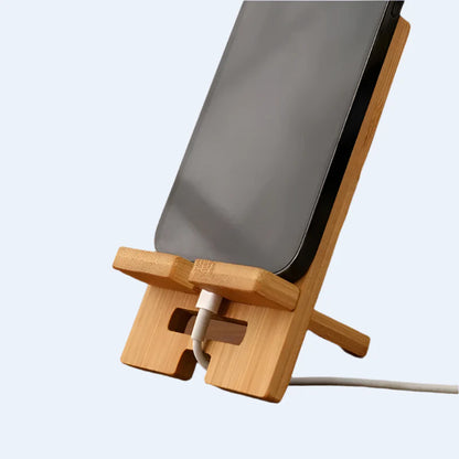 Habicare 9eight5 bamboo phone stand on a desk, showcasing a sleek eco-friendly design for hands-free phone use.