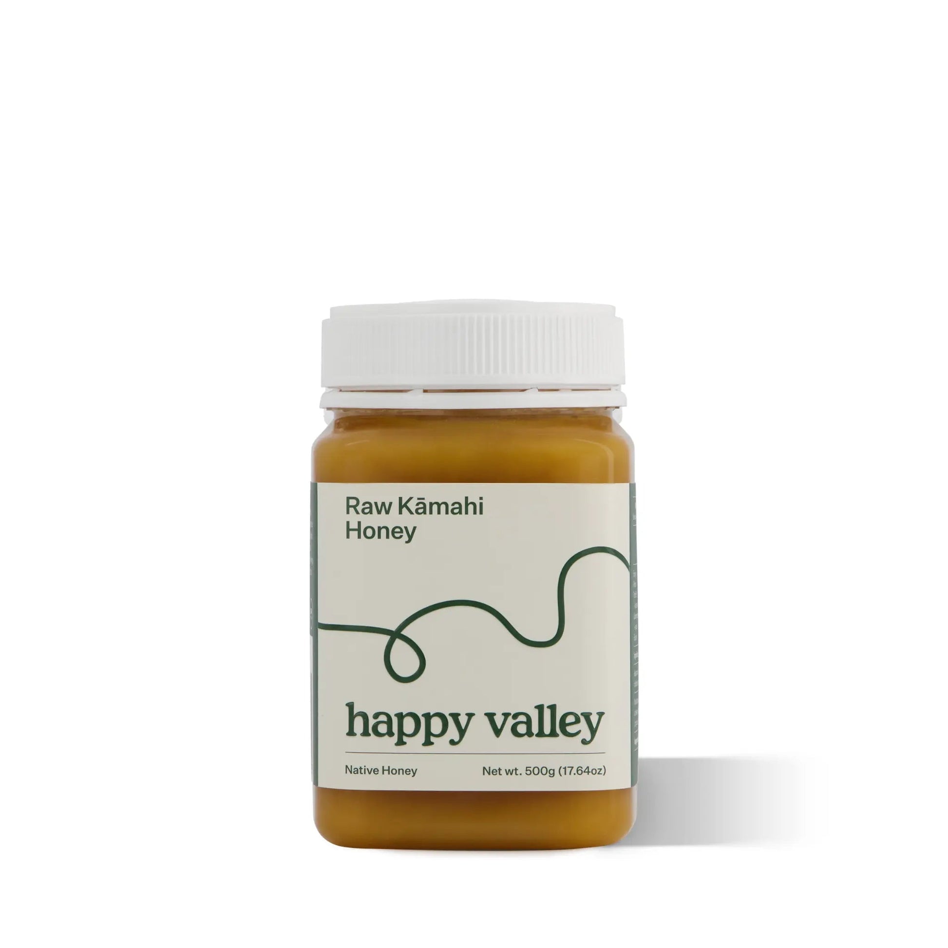 Jar of Happy Valley Honey Kamahi Gourmet & Raw Honey with golden color and honey dipper, showcasing natural and pure honey.