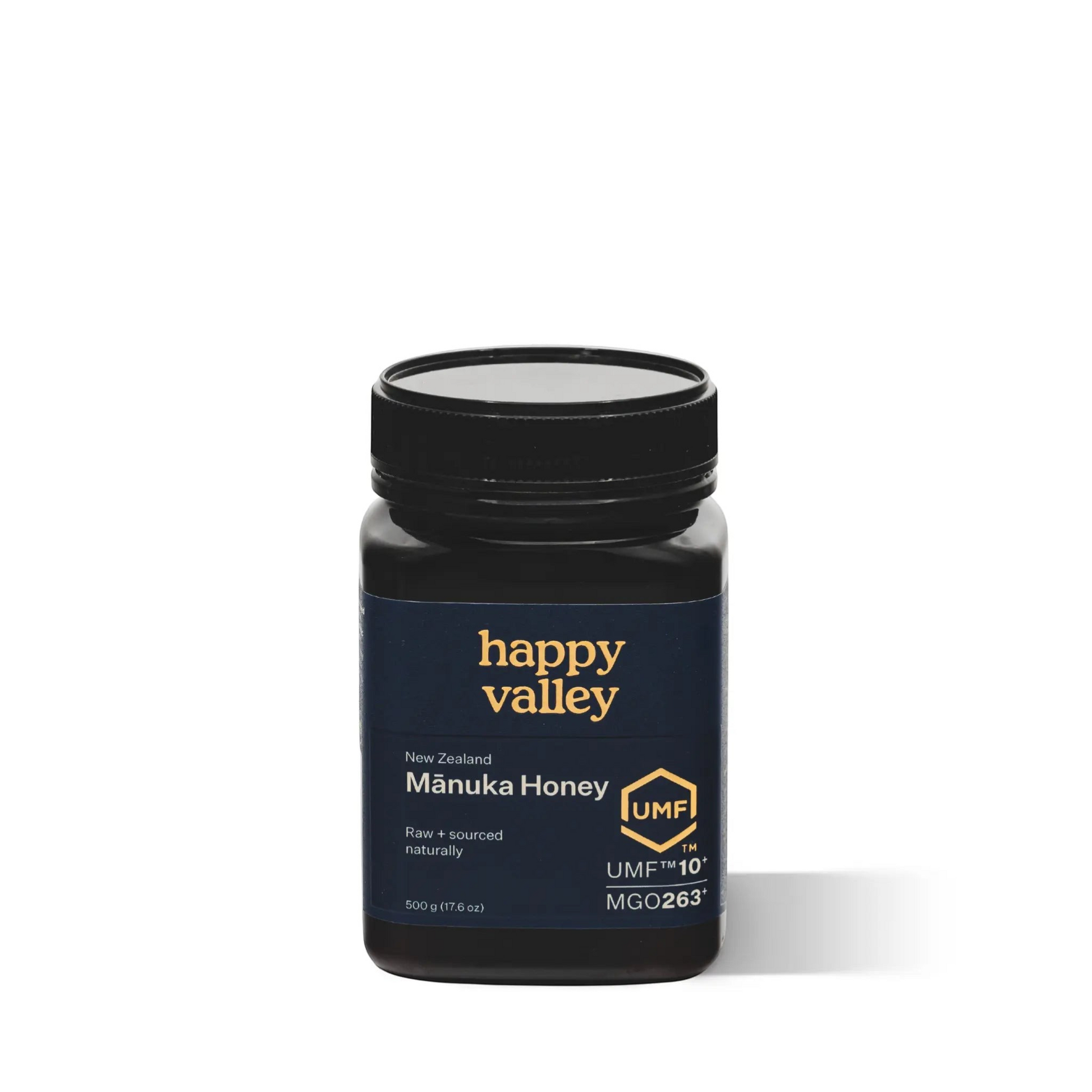Jar of UMF® 10+ Manuka Honey from Happy Valley Honey with a golden honey spread in a clear glass jar.