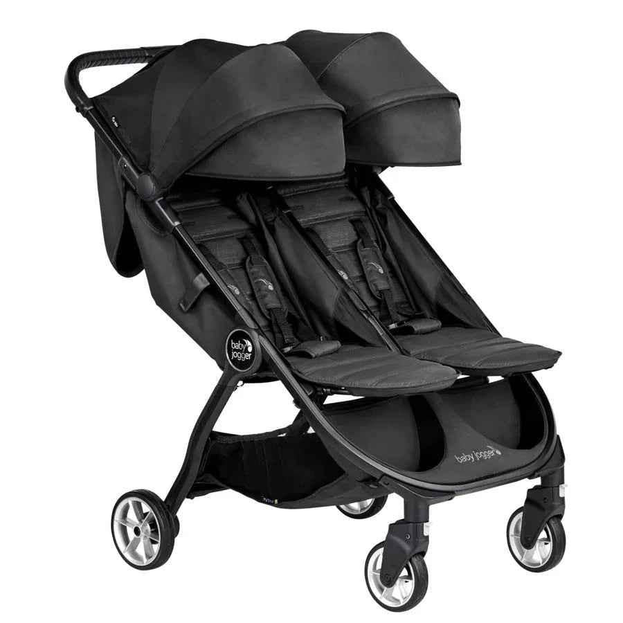 Baby Jogger City Tour 2 compact double stroller in pitch black, lightweight and foldable for easy maneuvering.