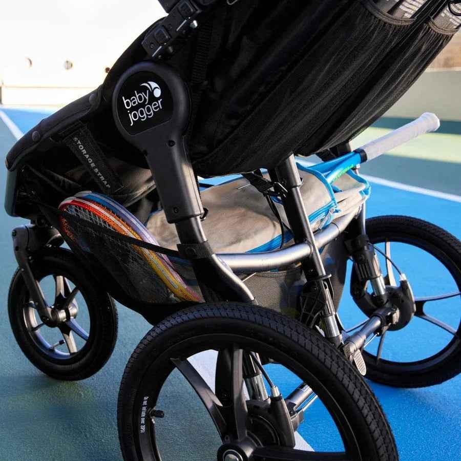 Baby Jogger Summit X3 jogging stroller in Midnight Black with adjustable handle and large wheels for outdoor jogging.
