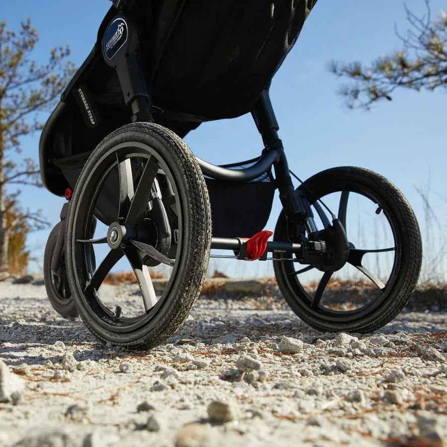 Baby Jogger Summit X3 jogging stroller in sleek Midnight Black, featuring sturdy wheels and adjustable canopy for active outings.