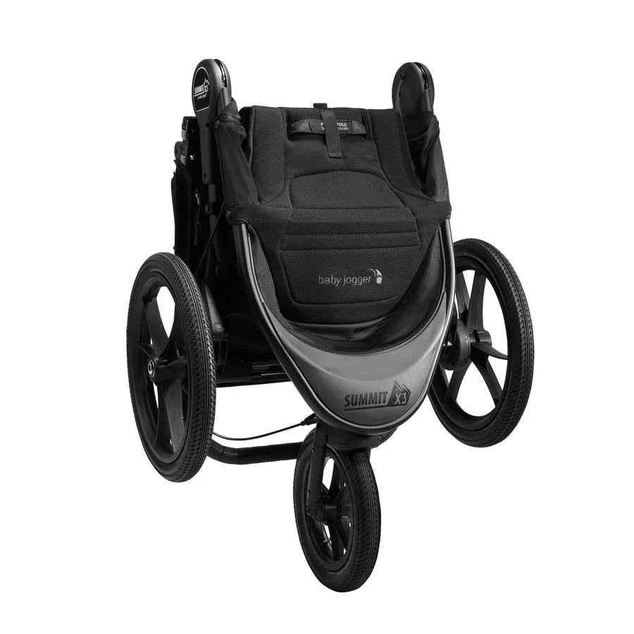 Baby Jogger Summit X3 jogging stroller in Midnight Black with adjustable handlebars and large wheels for outdoor jogging.