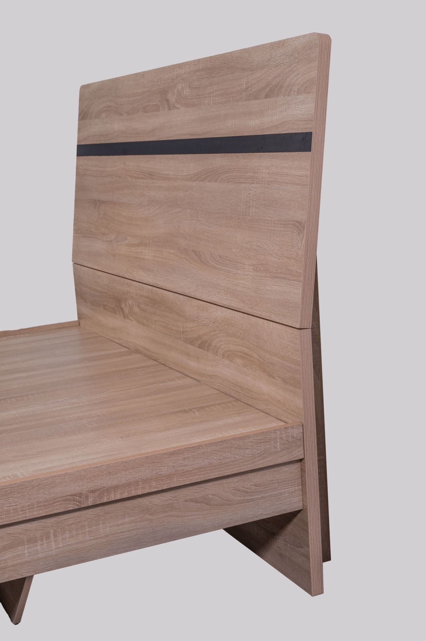 Light oak Byron bed frame with built-in storage from sue-e furniture, showcasing the bed's sleek design and sturdy construction.